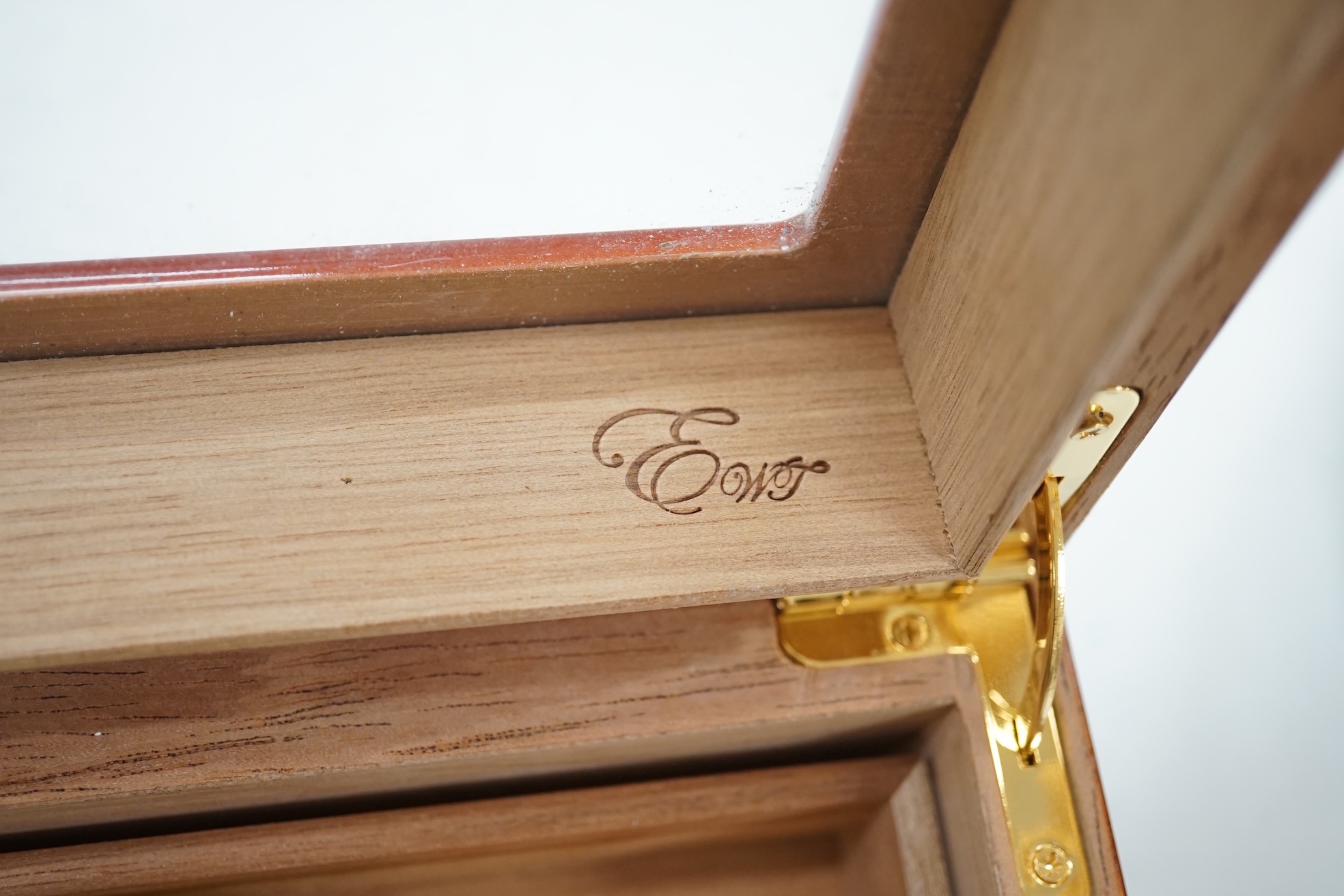 A modern EWT Thuya veneered humidor with keys, containing two boxes of Cohiba Esplendidos and Monte Cristo cigars (boxes opened). Condition - good